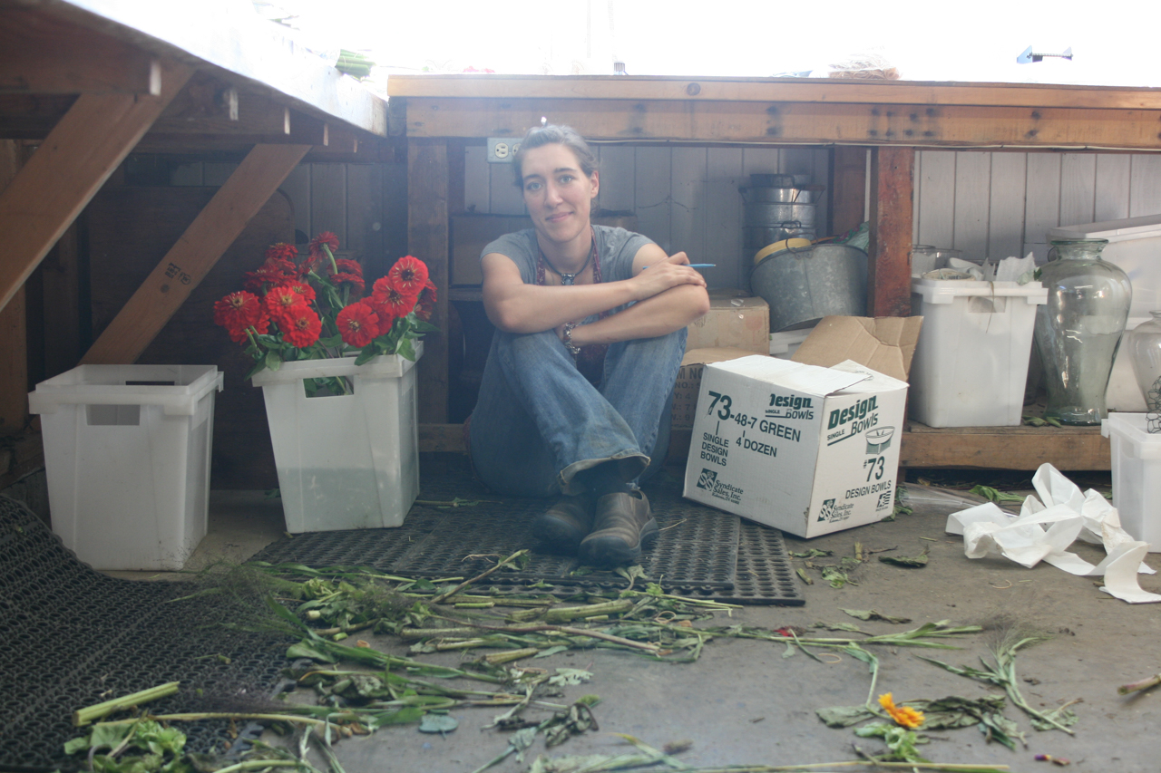 Erin Benzakein sits on the floor of her studio