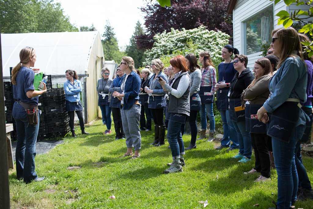 Erin Benzakein teaching a group of students at an on-farm Floret workshop